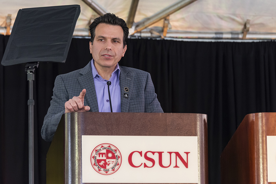 Autodesk President and CEO Andrew Anagnost speaks at a CSUN podium.