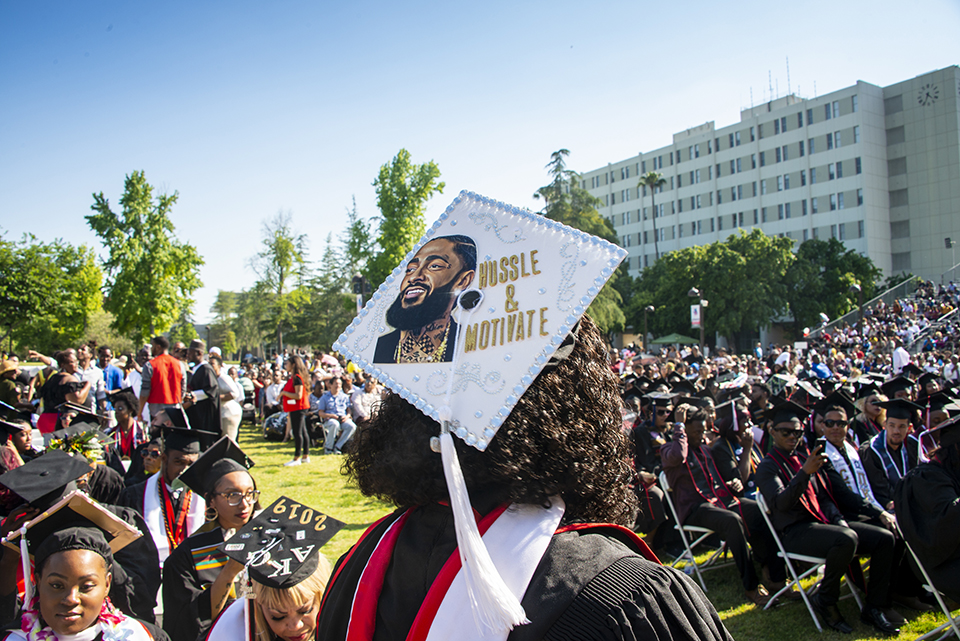 Student's graduation cap, with photo of slain rapper Nipsey Nussle that reads 