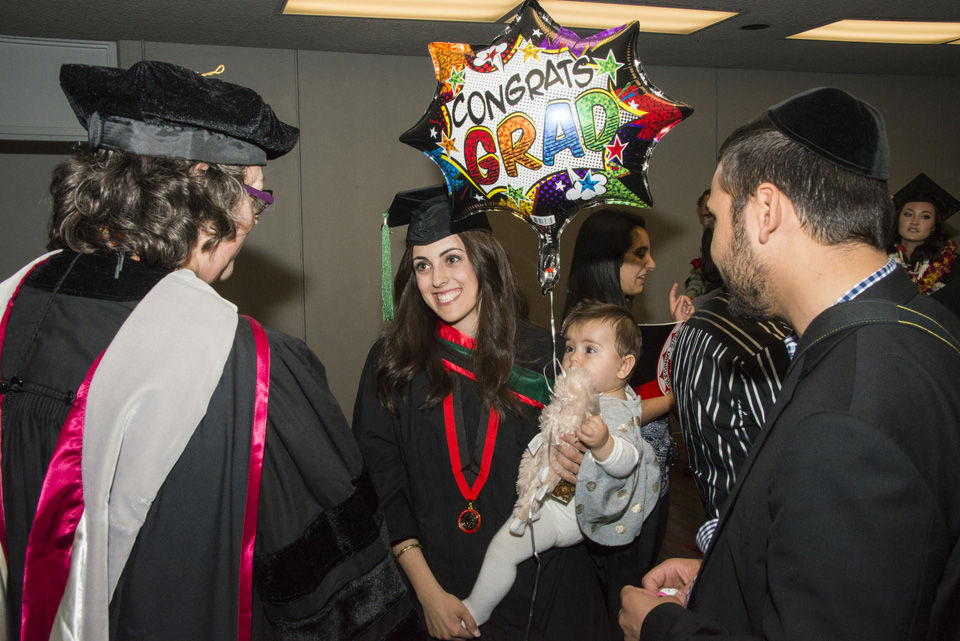 Graduating student celebrated by staff and family