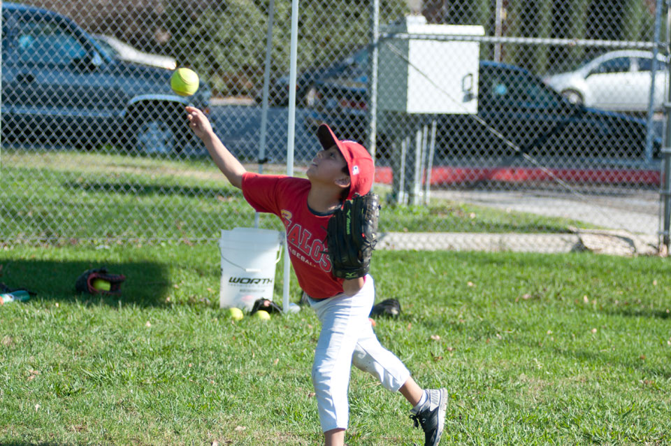 Kid throws baseball.