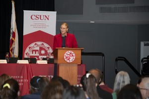 CSUN President Dianne F. Harrison at a CSUN podium during a candidate forum. 