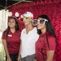 Dianne F. Harrison and students posing for a photo with big parody sun glasses.