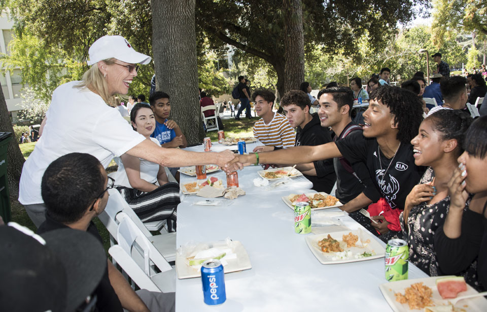 CSUN president Dianne F. Harrison mingling with students at the Presidents Picnic.