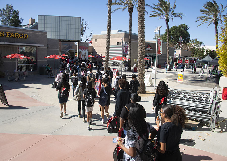 Students walk through the USU while on a tour.
