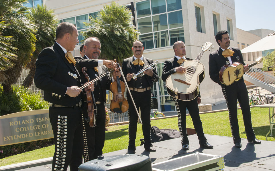 Mariachi band on stage on the Matador Bookstore lawn.