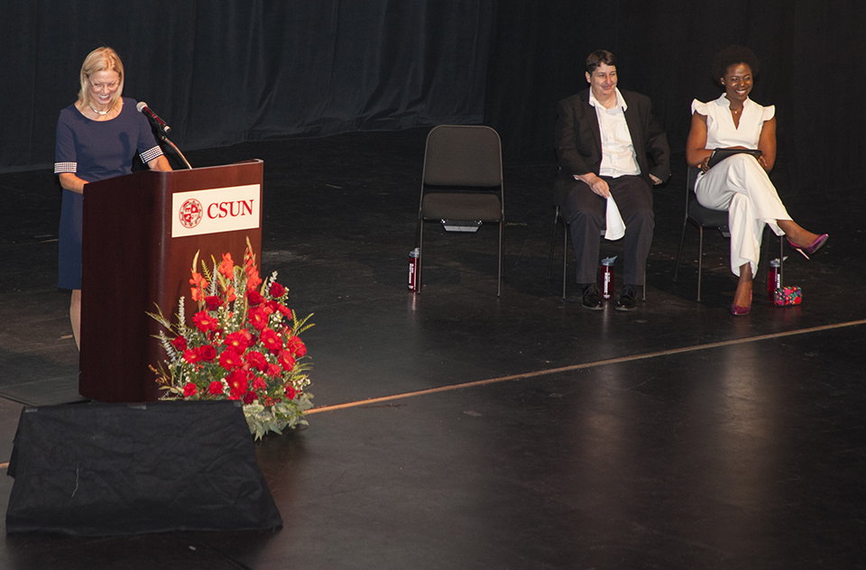 CSUN President Dianne F. Harrison delivers her annual Welcome Address while Mary-Pat Stein and Beverly Ntagu look on.