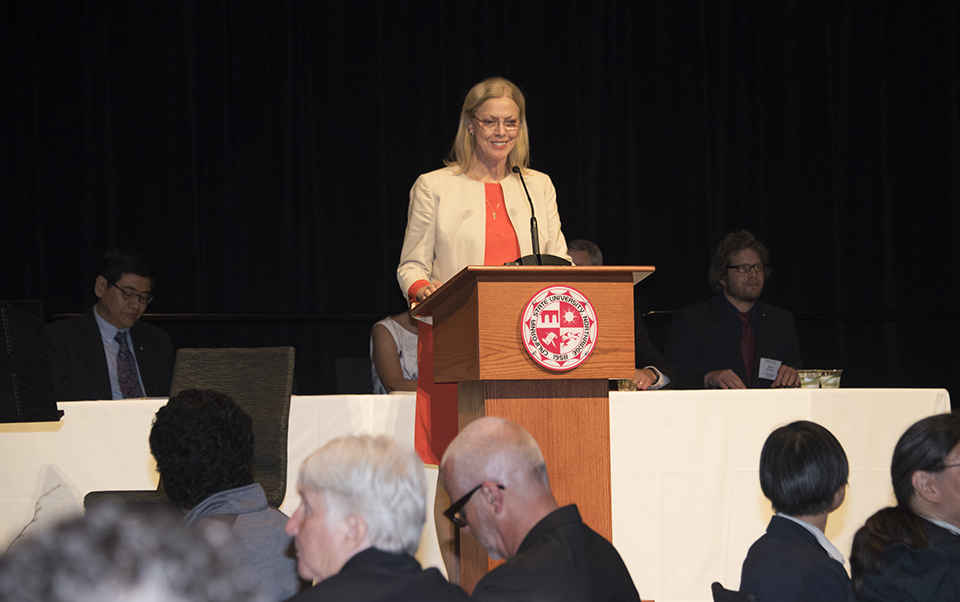CSUN President Dianne F. Harrison speaks at a podium at the 2018 Honored Faculty Reception.