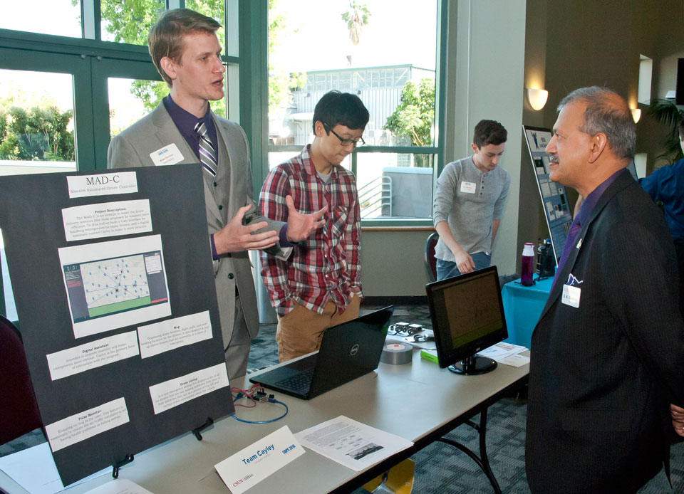 Explaining the project to Dean Ramesh.