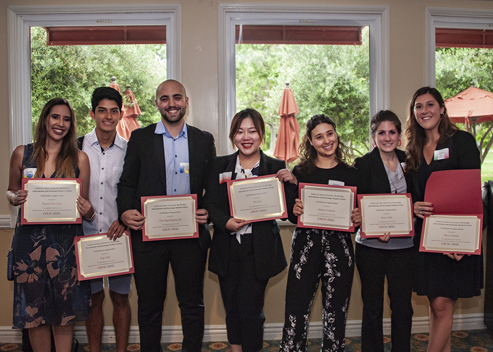 Students with their awards at the International and Exchange Student Graduation Reception