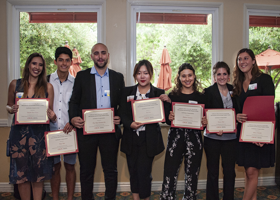 Students with their award certificates at the International and Exchange Student Graduation Reception.