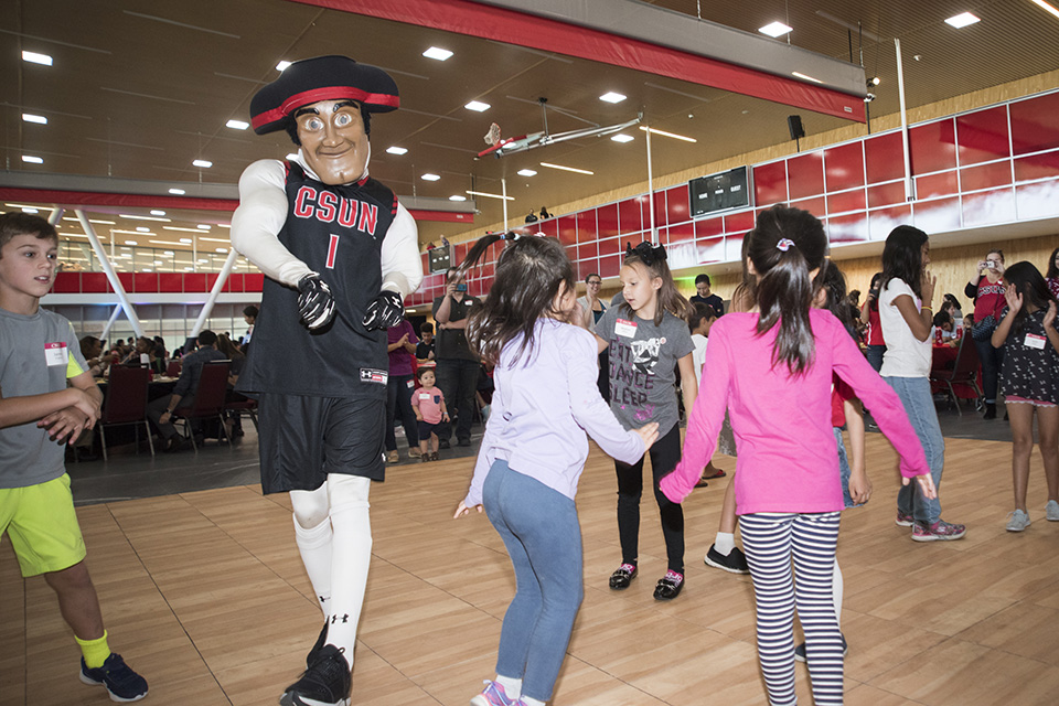 Mascot, Matty the Matador, dances with kids