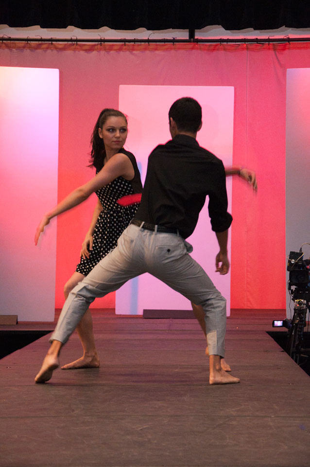 A female and male performance duo dance