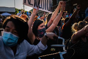 Masked protestors in a crowd in Minneapolis. 