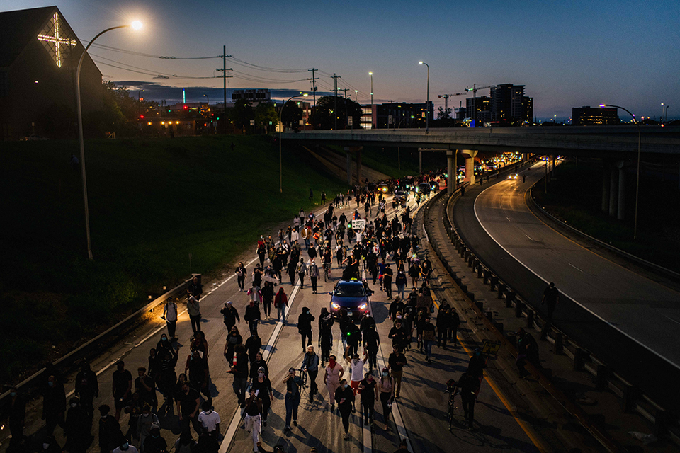 Protestors march through the freeway in Minneapolis.