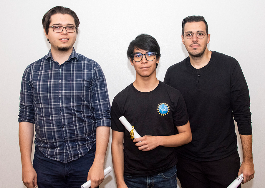 Gabriel Tyner, Natan Vargas and Sarkis Mikaelian of Top Gnomes receive their awards for Best Data Science and Best Reproducible Research during the awards ceremony of DataJam 2019 at the University Student Union on Oct. 18.