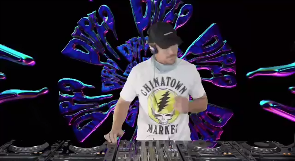 Diplo performs on turntables in front of a virtual background at the 2020 Big Show 20th anniversary show.