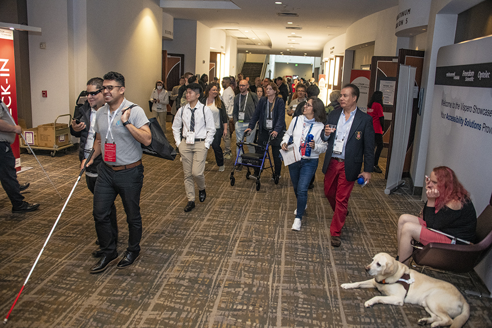 People walk through the hallways at the Anaheim Marriott Conference Center