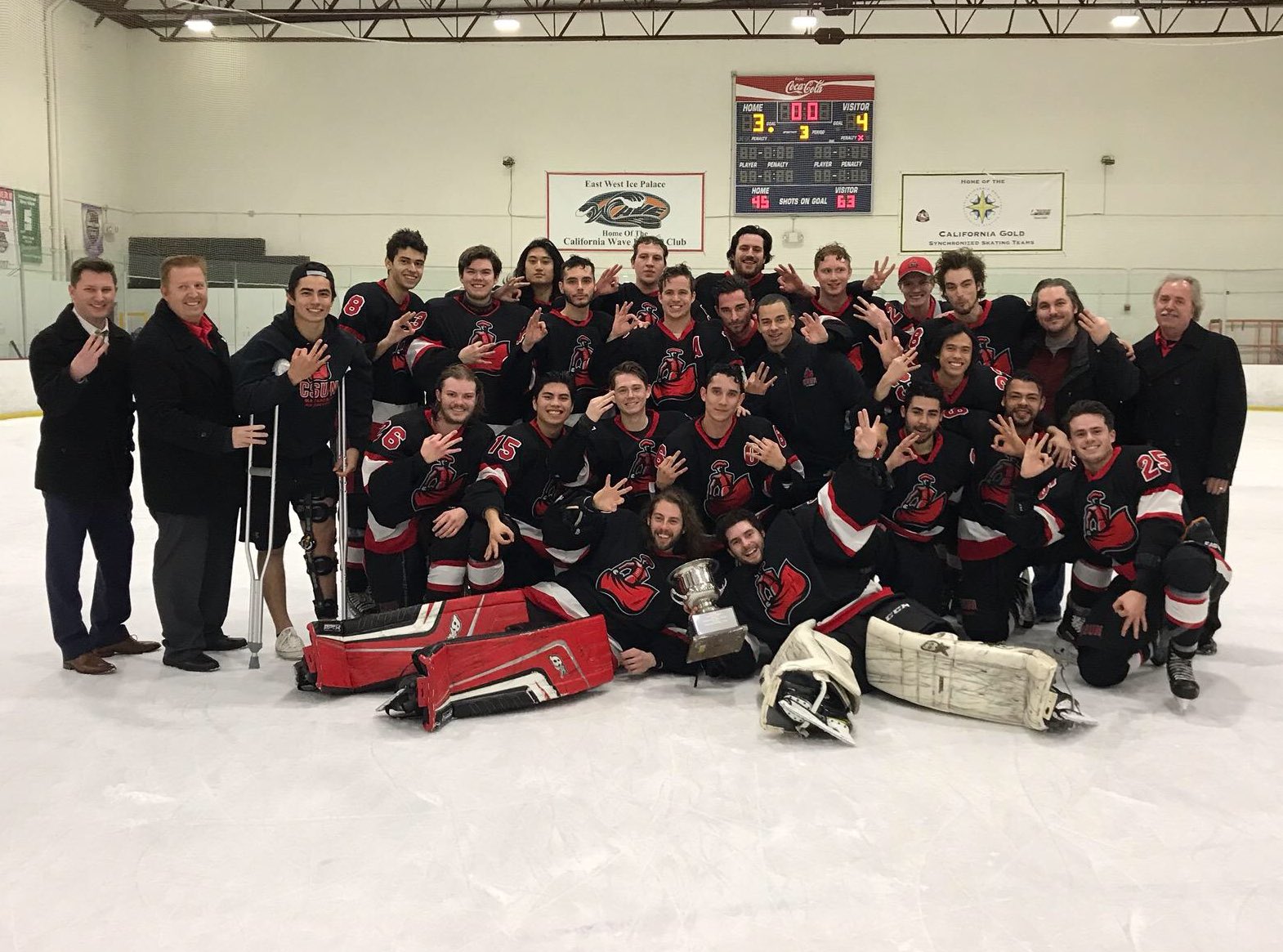 CSUN Ice Hockey Team smiles for a team photo after winning their third West Coast Hockey Conference championship for a third year in a row at the East West Ice Palace in Artesia, Calif. on Feb. 10.