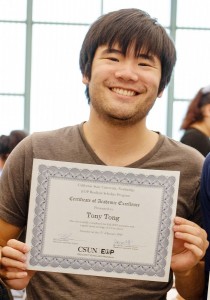 EOP Resilient Scholars Program senior Tony Tong poses with a certificate of academic achievement at an EOP awards banquet in the University Student Union.