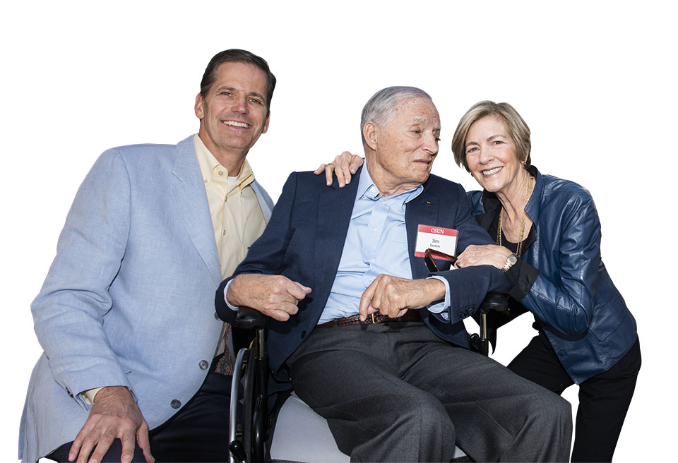 James L. Easton, sitting in a wheelchair, is flanked by Greg Easton and Phyllis Easton.
