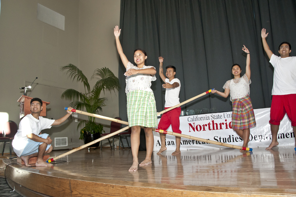 Filipino American Student Association members perform traditional dance called the Tinikling.