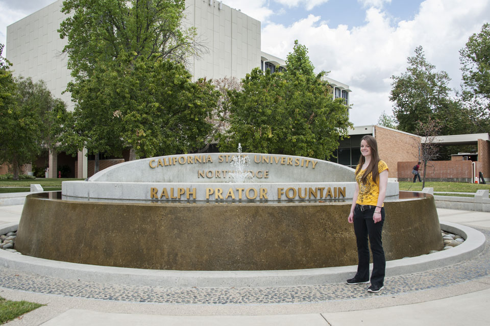 McKinzie Garrison in front of fountain