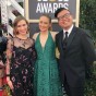 Allison Bird, Amanda Derzy and Robert Ahn pose on the red carpet before the 2018 Golden Globes.