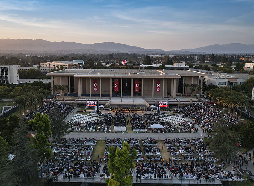 A drone camera captures the sunset over CSUN's final Commencement ceremony of 2022. Photo by David J. Hawkins.