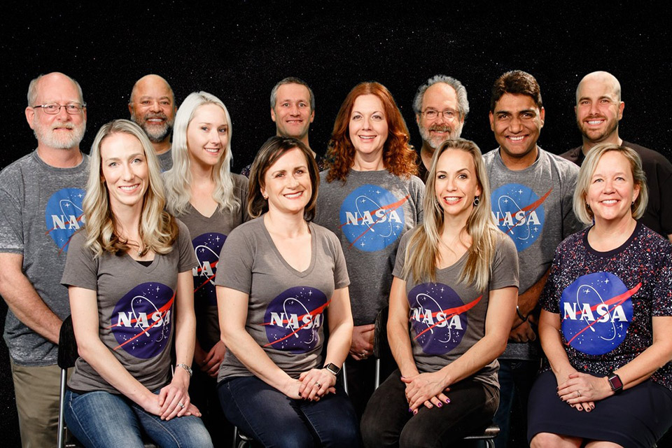 Hirst — first row, second from the right — sits among fellow candidates chosen to fly on the SOFIA Mission.