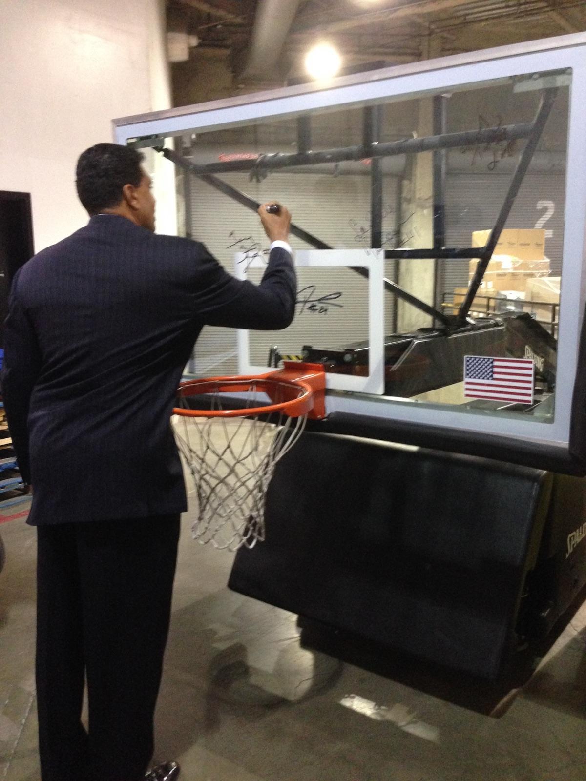 Theus signs backboard.