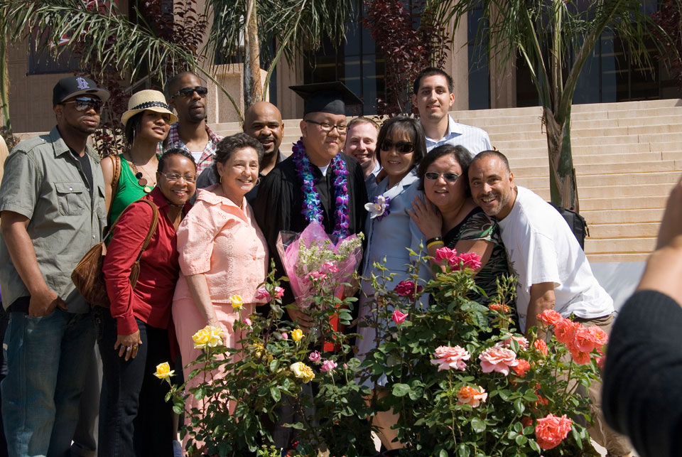 CSUN graduate with family and friends.