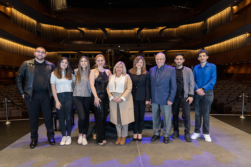 Kariné Poghosyan poses on The Soraya stage with students and faculty members primarily from of CSUN's Armenian Studies program.
