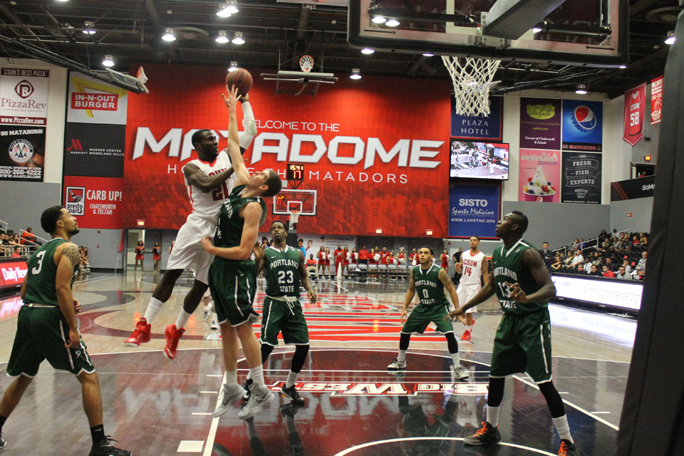 Stephen Maxwell flies to the basket.
