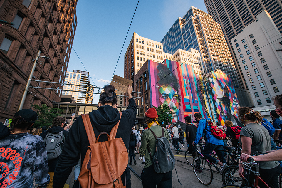 Protestors march through the colorful streets of Minneapolis.