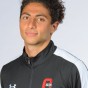 Headshot of Dawoud Mishal in CSUN Track Team uniform.