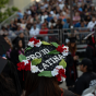 Mortarboard has red and white flowers with 