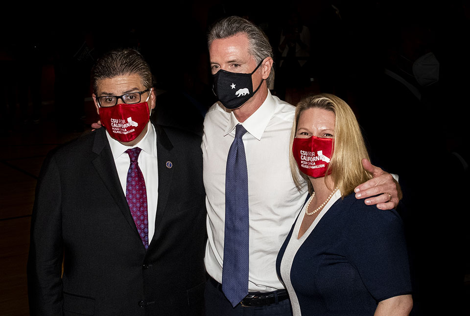CSUN President Erika D. Beck, Governor Gavin Newsom and CSU Chancellor Joseph Castro stand in front of a black backdrop at the Student Recreation Center.
