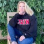 Erika D. Beck in CSUN sweatshirt and jeans.