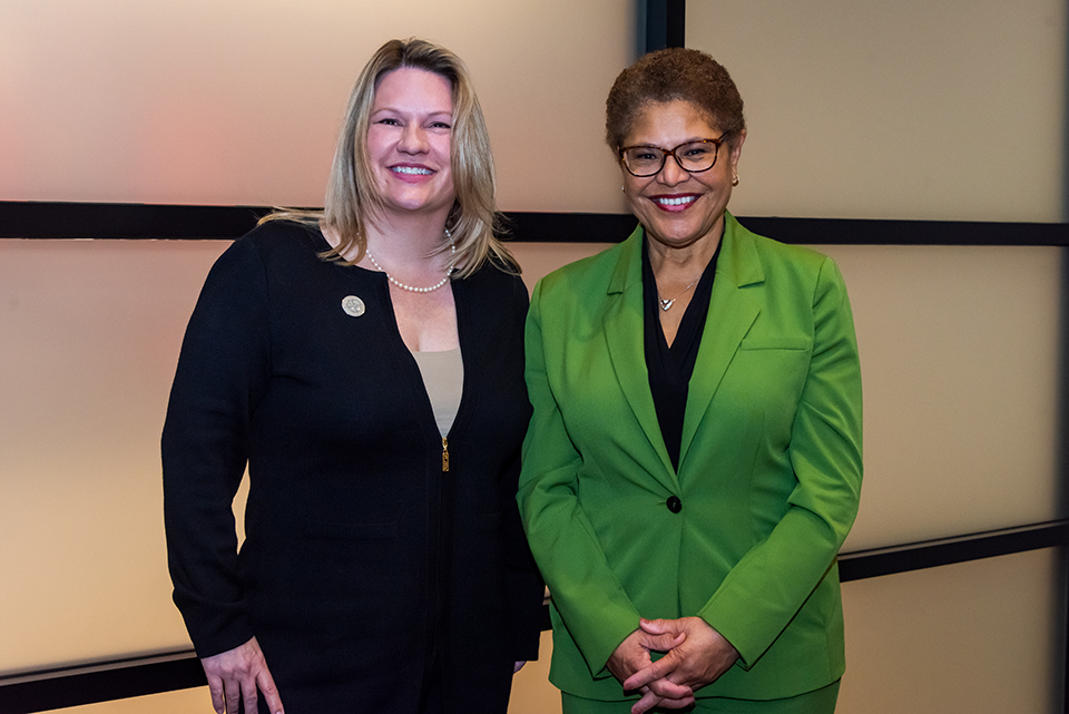CSUN President Erika D. Beck stands with Los Angeles Mayor Karen Bass, in front of a wall panel at the Orchard Conference Center.