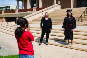 CSUN President Erika D. Beck stops in front of the University Library to congratulate new grad and sociology major Julia Alvarez.