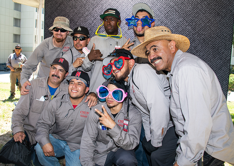 Staff from CSUN's Physical Plant Management pose at the photo booth for a fun group photo during the President's Picnic on the Bayramian Hall Lawn on Aug. 29.