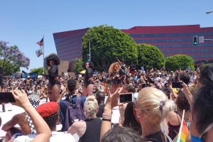 Protesters watch performers onstage at the "All Black Lives Matter" march on June 12 on Santa Monica Blvd.