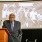Reverend James Lawson stands in front of projected image during his lecture on non-violence.