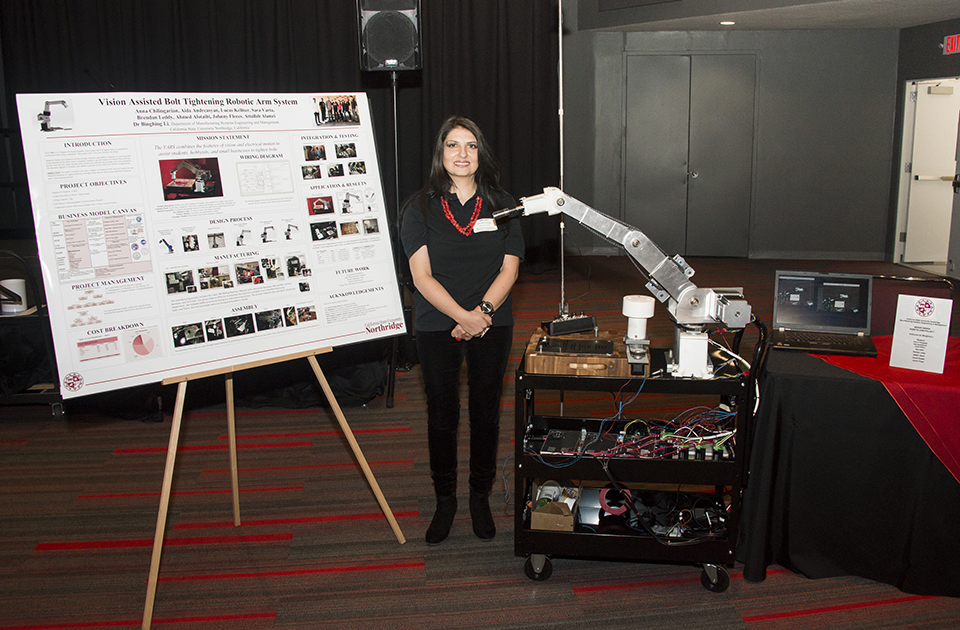 CSUN students present their robotic arm project.