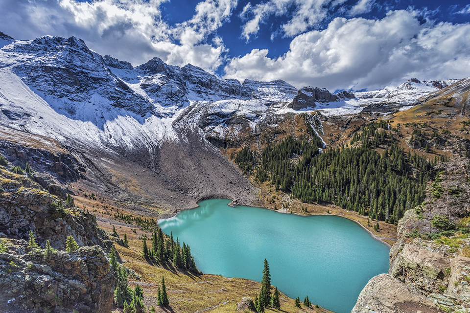 A view from a ledge high above Lower Blue Lake in the Mount Sneffels Wilderness near Telluride, Colorado. Research by CSUN geologists Joshua Schwartz and Elena Miranda has blown a hole into the long-accepted hypothesis that the Rocky Mountains were born by a single collision between tectonic plates, or pieces of the Earth’s crust, 90 million years ago. Photo by lightphoto, iStock.
