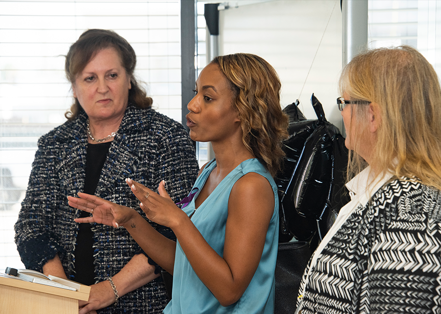 Chanel Smith (center), from the Los Angeles Mayor's Office of Public Safety, speaks alongside Kim Roth (left) and Joni Novosel (right) during the Legislative Brunch presentation.