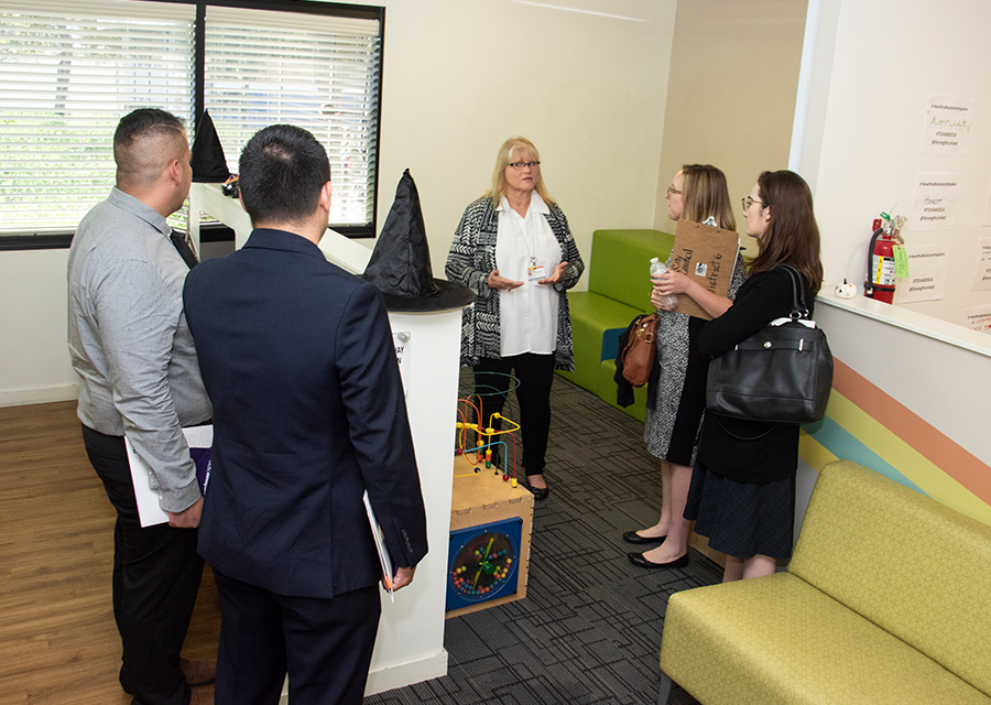After the presentation, Joni Novosel tours the Valley Reps around the Family Justice Center facility.