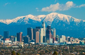 Downtown Los Angeles skyline with the snow capped San Gabriel Mountains in the background.