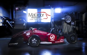 The Formula SAE Internal Combustion Vehicle team's red Formula One race car rests in CSUN's motorsports shop.