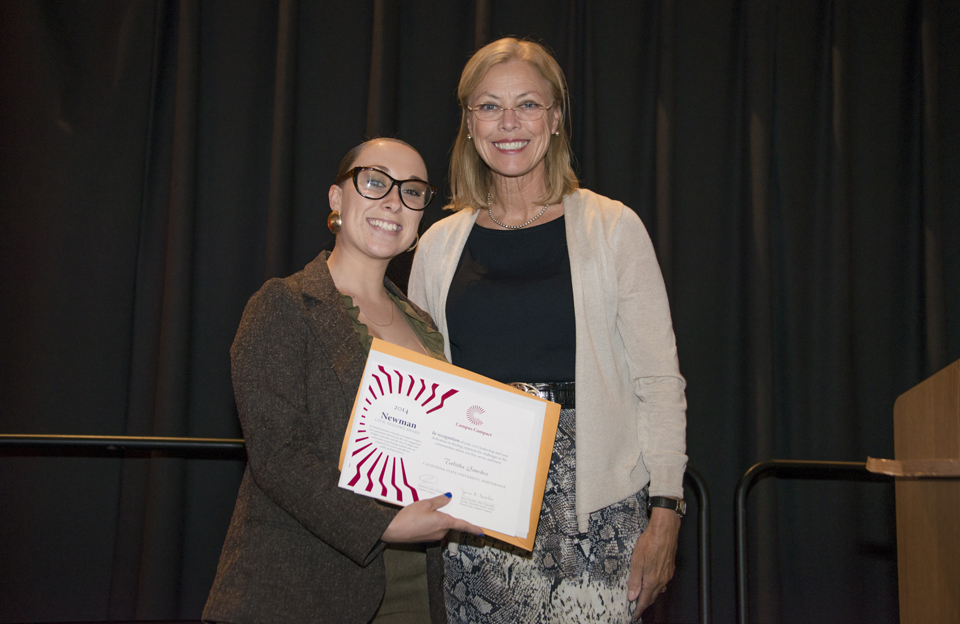 Tabitha Sanchez and university president Dianne F. Harrison at volunteer awards ceremony